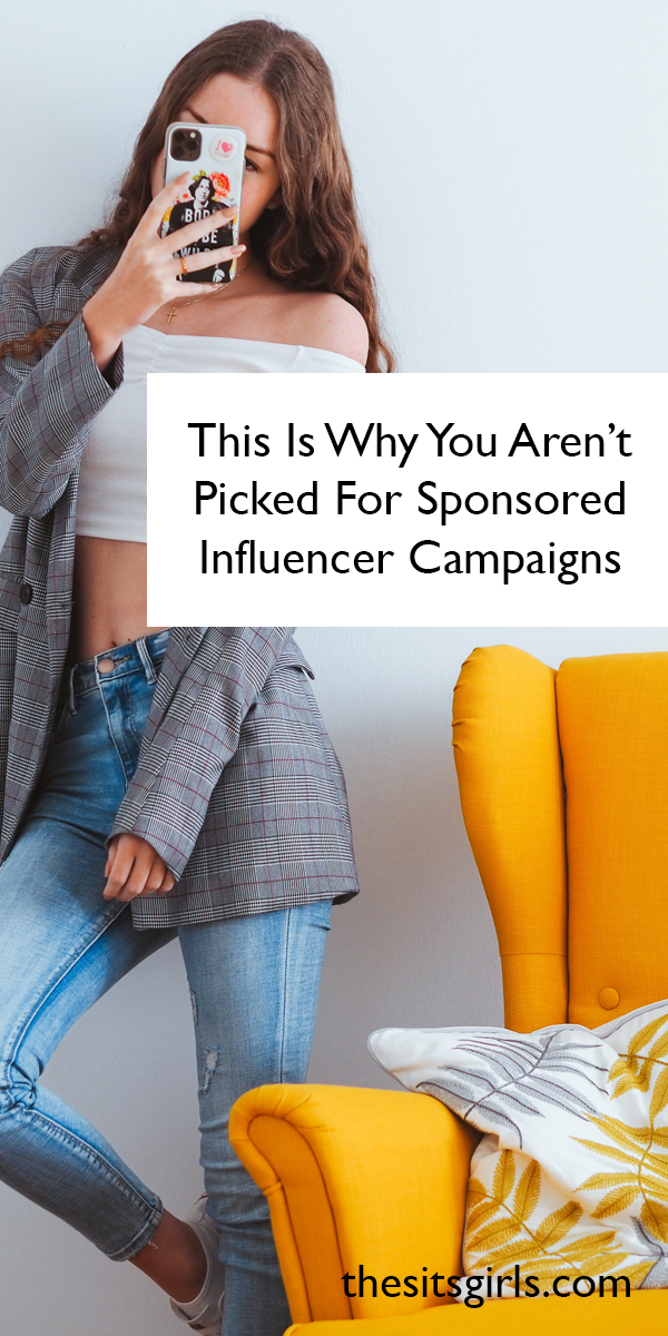 Photo of woman standing by a chair holding her phone with the words, 'This is why you aren't picked for sponsored influencer campaigns.'