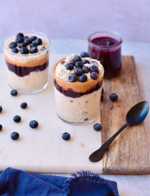 Jars of peanut butter and blueberry overnight oats. 