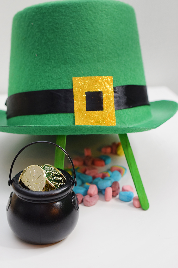Leprechaun trap with a green, felt hat, pot of gold, and Lucky Charm marshmallows. 