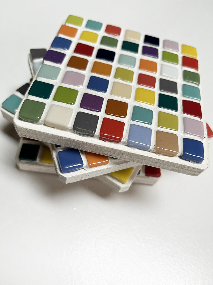 Stack of DIY mosaic tile coasters.