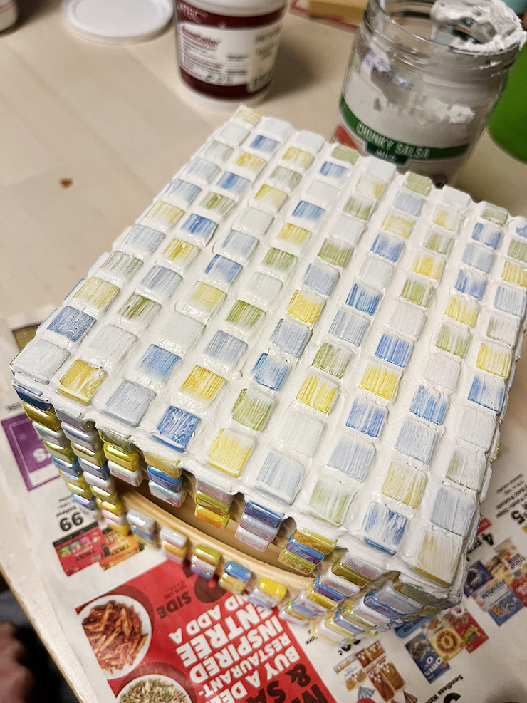 Tile box with grout covering the tiles.