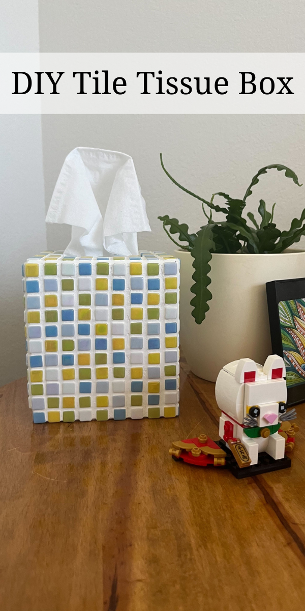 Picture of a mosaic tile tissue box with green, blue, and yellow tiles and the label DIY tile tissue box at the top of the image. 